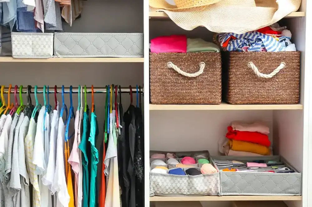 Neatly organized wardrobe with folded clothes on open shelves